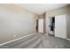 Bedroom featuring plush carpet, a closet, and a door to another room in the home at 1360 S Camellia Ct, Chandler, AZ 85286