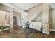 Entryway features tile floors, staircase with white railing, and a decorative bench seat at 1360 S Camellia Ct, Chandler, AZ 85286