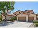 Charming two-story home with a three car garage, lush landscaping, and mature shade tree at 1360 S Camellia Ct, Chandler, AZ 85286