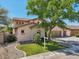 Charming two-story home with a three car garage, lush landscaping, and mature shade tree at 1360 S Camellia Ct, Chandler, AZ 85286