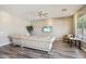 Comfortable living room features hardwood flooring, recessed lighting and a large sofa for entertaining at 1360 S Camellia Ct, Chandler, AZ 85286