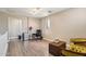 Upstairs loft features wood floors, a small desk, and additional seating at 1360 S Camellia Ct, Chandler, AZ 85286