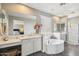 Bright main bathroom with large mirrors, double sinks, separate tub and walk-in shower at 1360 S Camellia Ct, Chandler, AZ 85286