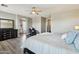 Main bedroom suite boasts wood-look flooring, ceiling fan and walk-in to main bath at 1360 S Camellia Ct, Chandler, AZ 85286