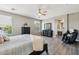 Spacious main bedroom features wood-look flooring, ceiling fan and leads to the main bath at 1360 S Camellia Ct, Chandler, AZ 85286