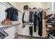 Spacious walk-in closet with wood rods and shelving, providing ample storage for clothing and accessories at 1360 S Camellia Ct, Chandler, AZ 85286