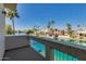 Balcony view of the canal, lush landscaping, and waterfront homes creates a serene outdoor living space at 1414 W Coral Reef Dr, Gilbert, AZ 85233