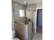 Bathroom showcasing a glass shower, tiled walls, and modern fixtures at 1414 W Coral Reef Dr, Gilbert, AZ 85233