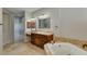 Bathroom features a soaking tub, large vanity and a framed mirror at 1414 W Coral Reef Dr, Gilbert, AZ 85233
