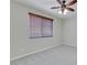 Bedroom with neutral walls, carpet flooring, a ceiling fan, and a window with blinds at 1414 W Coral Reef Dr, Gilbert, AZ 85233