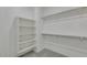 Spacious walk-in closet with custom shelving and ample storage space at 1414 W Coral Reef Dr, Gilbert, AZ 85233