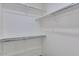 Walk-in closet with ample shelving and storage space at 1414 W Coral Reef Dr, Gilbert, AZ 85233