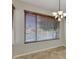 Dining room area featuring a large window with blinds and a chandelier at 1414 W Coral Reef Dr, Gilbert, AZ 85233