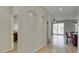 Open foyer featuring tile floors, arched display niches and views of the lake at 1414 W Coral Reef Dr, Gilbert, AZ 85233