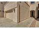 Exterior side view of garage and stucco home, showing driveway and entry at 1414 W Coral Reef Dr, Gilbert, AZ 85233