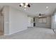 Open living room with ceiling fans, balcony, and built-in wet bar at 1414 W Coral Reef Dr, Gilbert, AZ 85233