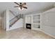 Open living room with a fireplace, shelving, staircase, and tile flooring at 1414 W Coral Reef Dr, Gilbert, AZ 85233