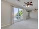 Open living room with sliding glass doors, balcony and neutral carpet at 1414 W Coral Reef Dr, Gilbert, AZ 85233