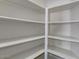 White shelving unit perfect for organizing and storing food items in the pantry at 1414 W Coral Reef Dr, Gilbert, AZ 85233