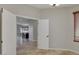 Bright room showcasing neutral walls, tile flooring, and an open doorway leading to the kitchen area at 1414 W Coral Reef Dr, Gilbert, AZ 85233