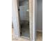 Walk-in shower featuring a glass door, tiled walls and built-in bench at 1414 W Coral Reef Dr, Gilbert, AZ 85233