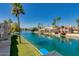 Beautiful canal view highlighting the waterfront homes and tropical landscaping at 1414 W Coral Reef Dr, Gilbert, AZ 85233