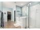 Light-filled bathroom features tile floors, a soaking tub, and glass shower at 14907 N 177Th Ave, Surprise, AZ 85388