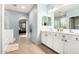 Bathroom features a dual sink vanity, tile flooring, and blue accents at 14907 N 177Th Ave, Surprise, AZ 85388