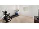 Bedroom equipped with exercise bike, treadmill, and window for natural light at 14907 N 177Th Ave, Surprise, AZ 85388