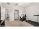 Bright bedroom with a closet, carpet flooring, and workout equipment providing a great fitness space at 14907 N 177Th Ave, Surprise, AZ 85388