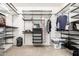 Walk-in closet provides ample storage with custom shelving and hanging racks at 14907 N 177Th Ave, Surprise, AZ 85388