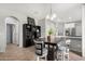 Open-concept dining area with stylish furnishings, seamlessly connected to the kitchen and other living spaces at 14907 N 177Th Ave, Surprise, AZ 85388