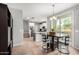 Open-concept dining area with stylish furnishings, seamlessly connected to the kitchen and other living spaces at 14907 N 177Th Ave, Surprise, AZ 85388
