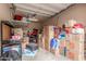 Well-lit garage with overhead storage, boxes, and organization, ideal for storage and organization needs at 14907 N 177Th Ave, Surprise, AZ 85388