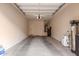 Spacious garage with ample room for parking, storage, and housing a water filtration system at 14907 N 177Th Ave, Surprise, AZ 85388