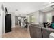 Spacious open-concept living space with tile flooring connecting the dining and kitchen areas, creating a modern feel at 14907 N 177Th Ave, Surprise, AZ 85388