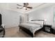 Spacious main bedroom boasts a tray ceiling and a ceiling fan at 14907 N 177Th Ave, Surprise, AZ 85388
