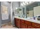 Bathroom featuring double sink vanity with modern fixtures, providing convenience and functionality at 15910 W Shangri La Rd, Surprise, AZ 85379