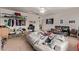 Bright, spacious bedroom with versatile use of space, featuring a ceiling fan and closet at 15910 W Shangri La Rd, Surprise, AZ 85379