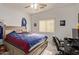Cozy bedroom with natural light, sports-themed decor, a ceiling fan, and carpeted flooring at 15910 W Shangri La Rd, Surprise, AZ 85379