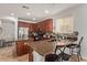 Kitchen with wooden cabinets, granite countertops, stainless steel appliances and barstool seating at 15910 W Shangri La Rd, Surprise, AZ 85379