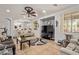 Open-concept living room features a modern ceiling fan, tile floors, and plenty of seating at 15910 W Shangri La Rd, Surprise, AZ 85379