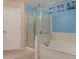 Bathroom featuring a soaking tub and glass shower at 16527 N 71St Dr, Peoria, AZ 85382