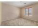Spacious bedroom with natural light, neutral carpet, and ample space for furnishings at 16527 N 71St Dr, Peoria, AZ 85382