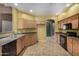 Bright kitchen with black appliances and tile flooring at 16527 N 71St Dr, Peoria, AZ 85382