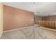 Spacious loft with carpet and a railing, ideal for a playroom or second living area at 16527 N 71St Dr, Peoria, AZ 85382