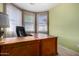 Natural light in this office with traditional desk, neutral walls at 16527 N 71St Dr, Peoria, AZ 85382
