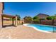 Backyard oasis with a private pool and covered patio at 16527 N 71St Dr, Peoria, AZ 85382