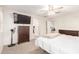 Spacious bedroom features a TV, ceiling fan, and closet access at 16632 W Jenan St, Surprise, AZ 85388