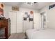 A cozy bedroom with a ceiling fan, closet, and natural light for a comfortable and inviting atmosphere at 16632 W Jenan St, Surprise, AZ 85388